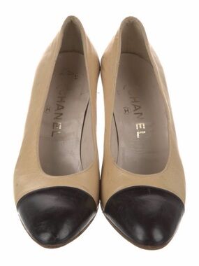 CHANEL Interlocking Beige and Black Two-Tone Cap-Toe CC Leather Pumps